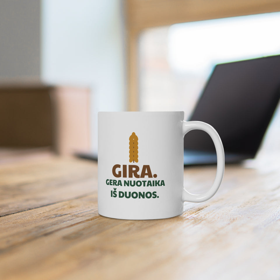 Gira. Gera nuotaika iš duonos. – puodelis ant stalo