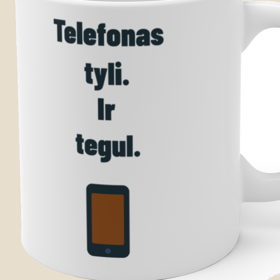 Telefonas tyli. Ir tegul. — Puodelis, artimas spaudos vaizdas